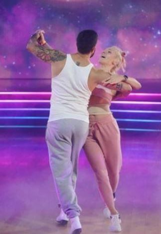 Ray Burgess daughter Sharna Burgess in a dance platform with her dancing partner.